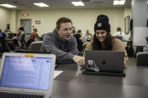 Maxwell Sprague (left), Katy Whitt (right) and students work on research informs policy to Alleviate Housing Insecurity at the local level in a multidisciplinary courses, Capstone in Psychology (PSYC 401), Intro to Research Methods (POLS 331), Soc Welfare Policy/Progs/Svcs (SWRK 485), on Thursday, December 5, 2019 in Chico, Calif. (Jason Halley/University Photographer/CSU, Chico)